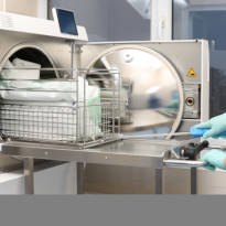 Healthcare worker and autoclave