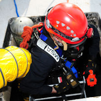 Worker entering confined space