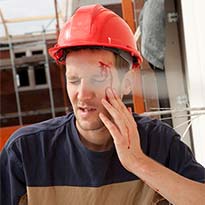 Worker with bloody face injury