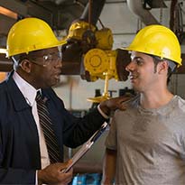A safety manager recognizing an employee
