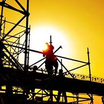 Worker on supported scaffold